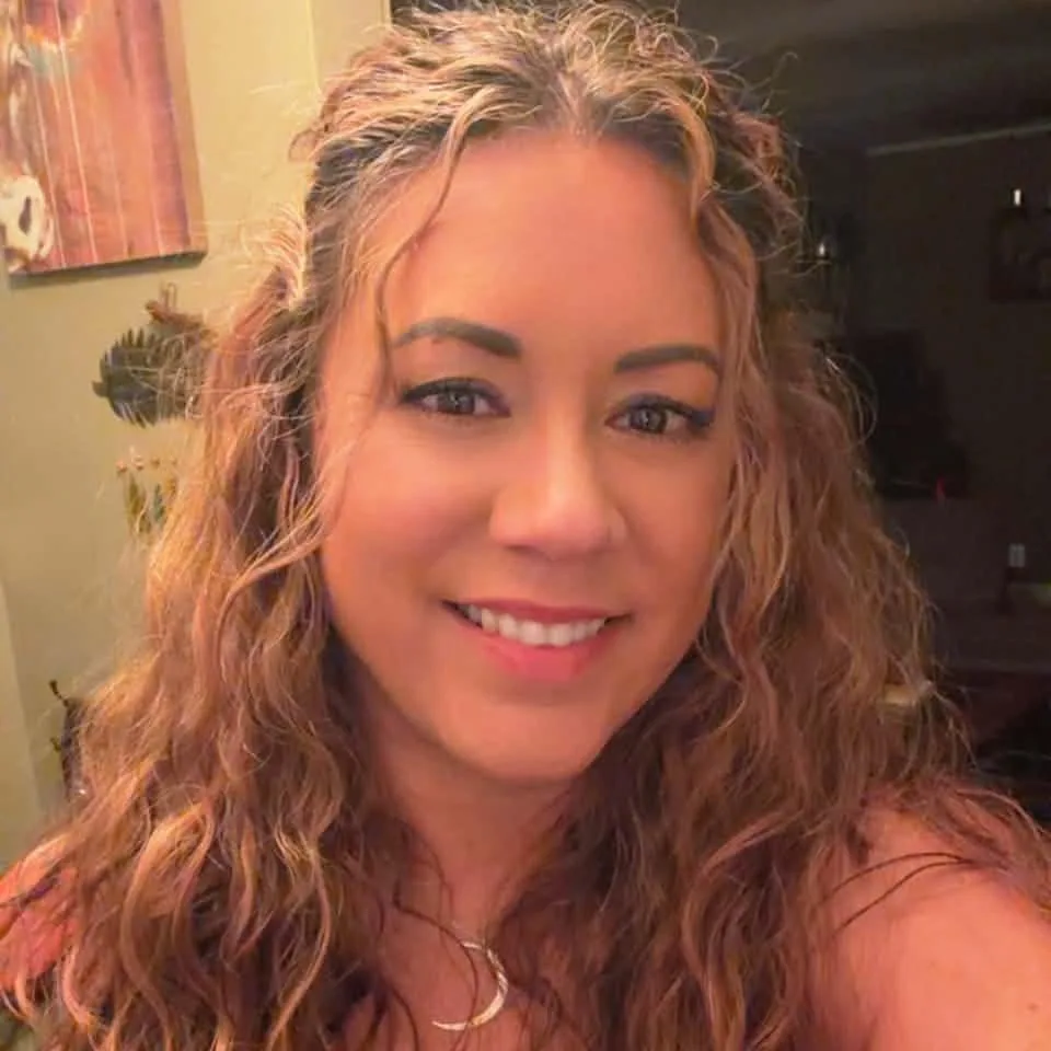 Jennifer, a Strategic Stewardship client, smiling at home