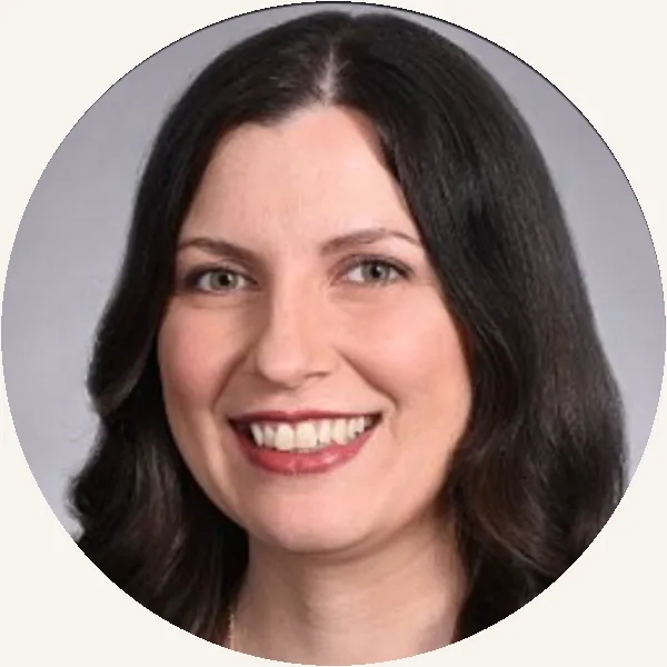 Kristy, a Strategic Stewardship client, smiling in a studio portrait